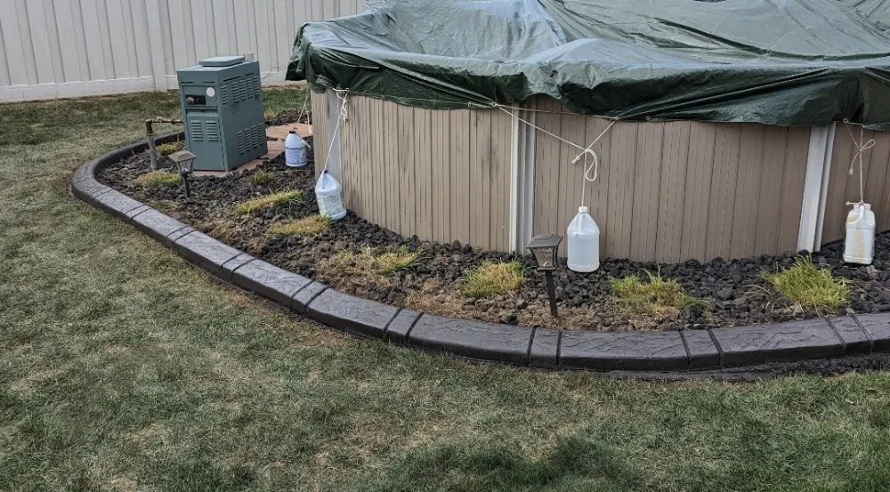 Local residential landscaping for year-round maintenance in Jackson, MI by Decorative Curbing