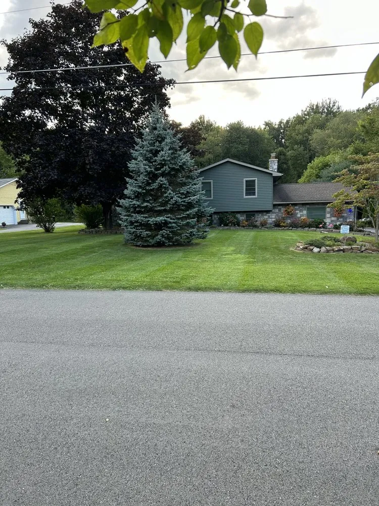 Affordable landscape design for residential properties in Salem, OH by Dedicated Lawn Service
