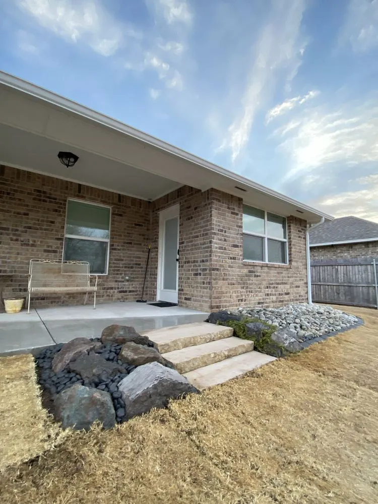 Professional yard cleanup service for homes in Oklahoma City, OK by DeHart Landscape and Masonry