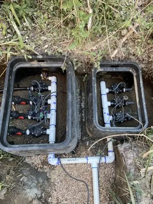 Delhierro Sprinklers and Landscape Lighting Logo