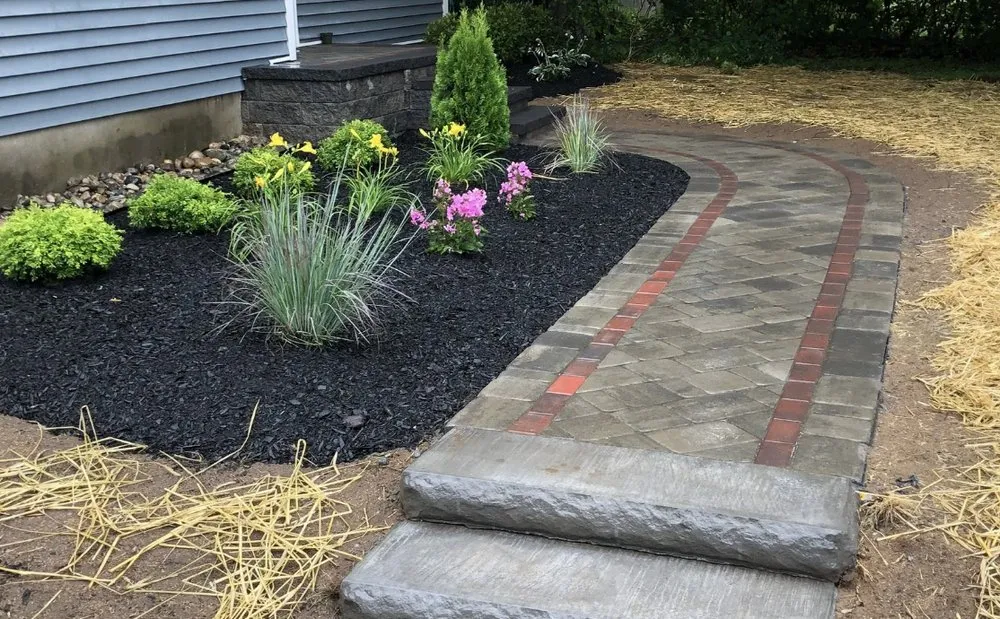 Professional lawn mowing service for residential properties in Schenectady, NY by DeLorenzo Landscaping