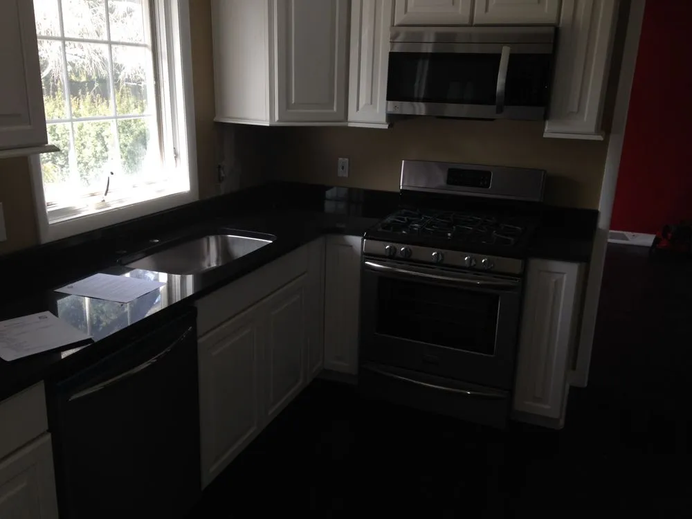 Professional lawn care service for residential properties in Euclid, OH by Design 2