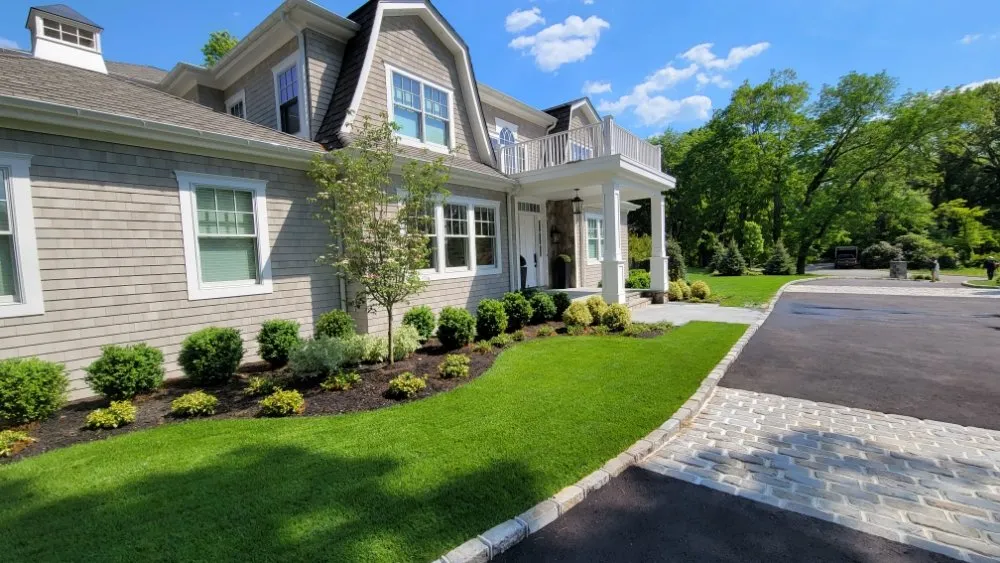 Professional residential landscaping in Massapequa, NY by Design and Build Landscape