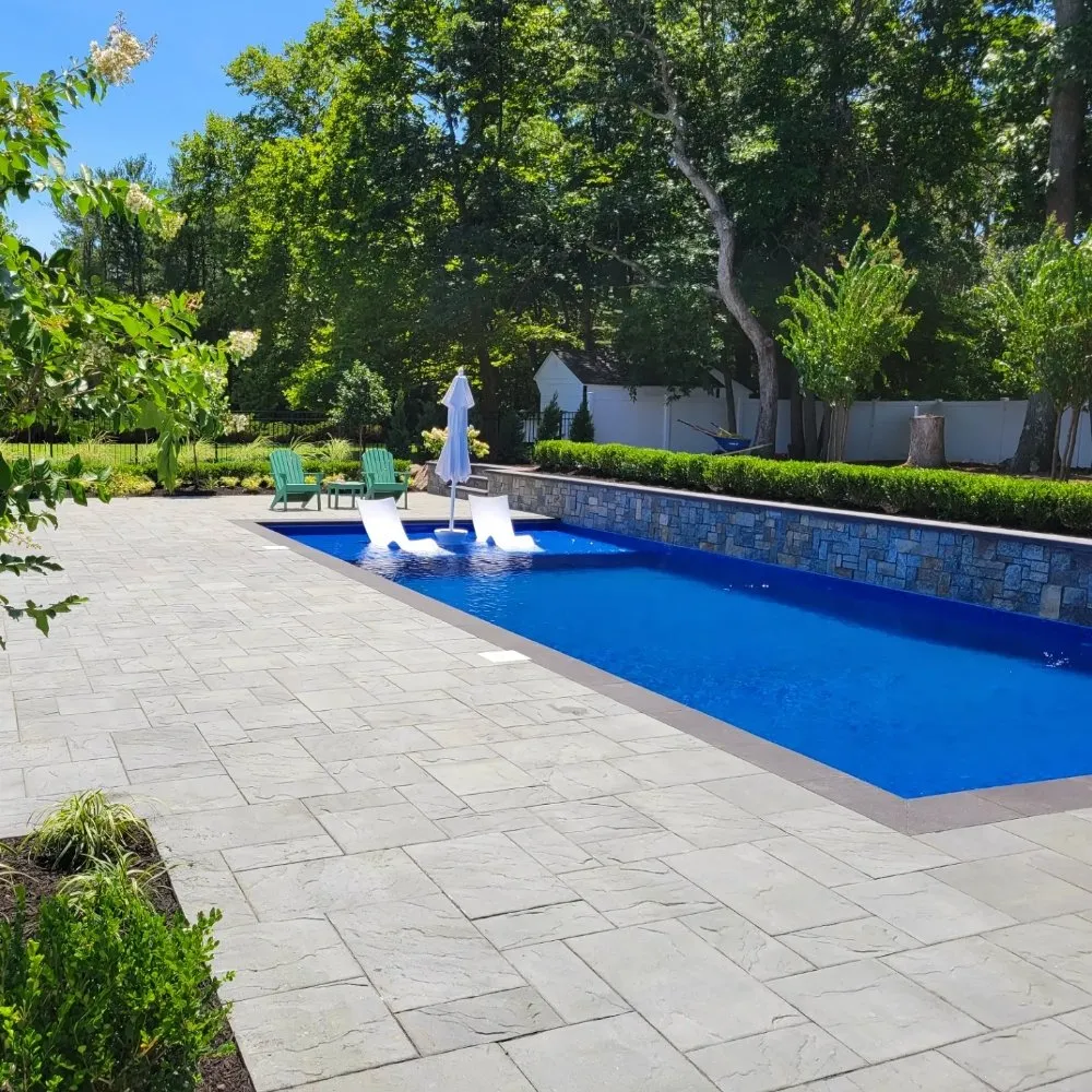 Custom residential landscaping for year-round maintenance in Massapequa, NY by Design and Build Landscape