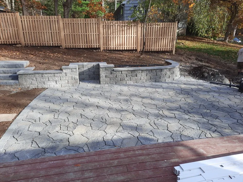 Reliable lawn care service in Westbrook, CT by Designer Fence & Stone