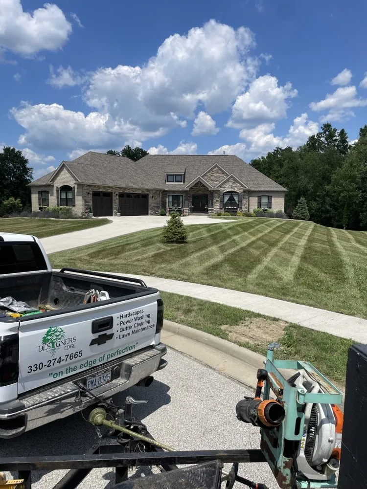 Affordable lawn mowing service for year-round maintenance in Kent, OH by Designers Edge