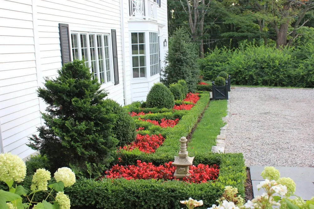 Professional yard cleanup service for residential properties in New Milford, CT by Designing Eden