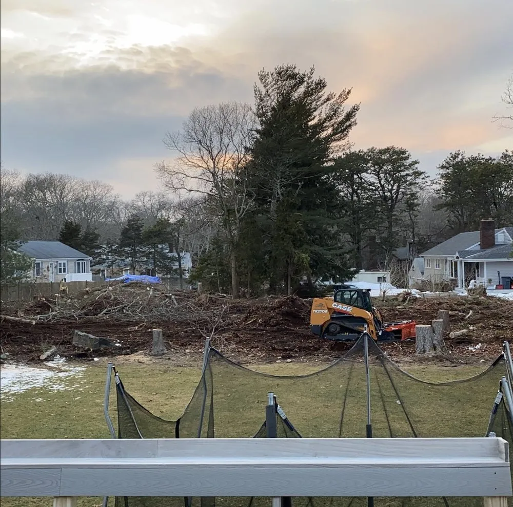 Custom yard cleanup service for year-round maintenance in Centerville, MA by DeSouza Landscaping and Tree Service