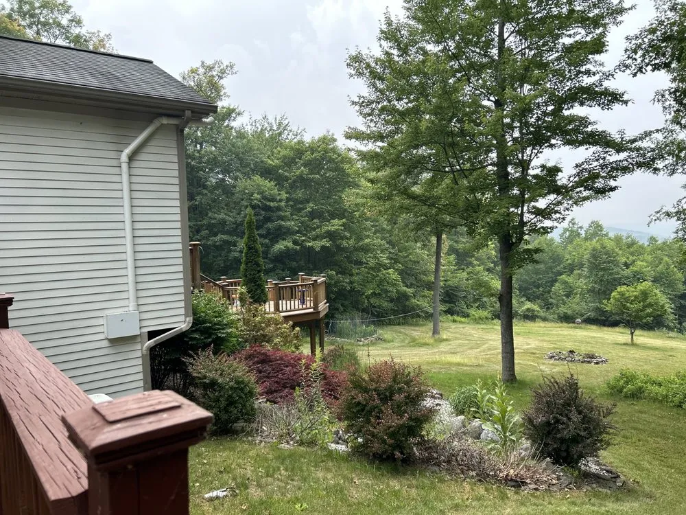 Custom lawn mowing service for residential properties across Corning, NY - DETER LAWN SCULPTURES