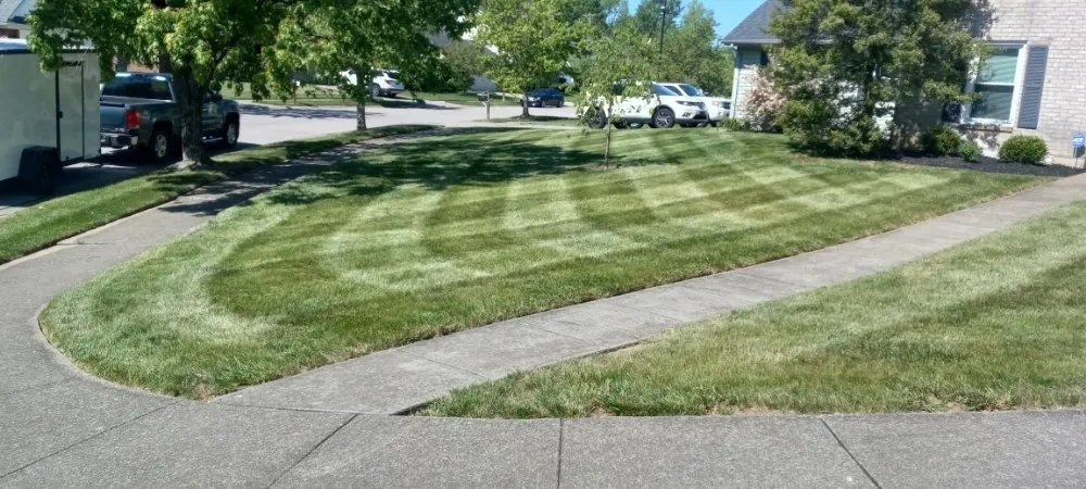 Reliable lawn mowing service with custom design in Lexington-Fayette, KY by Devine Landscapes and Exterior Homes Services
