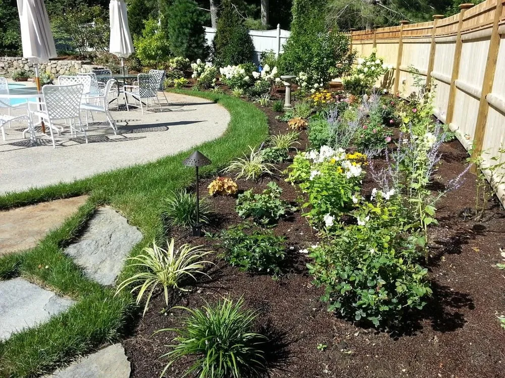 Custom yard maintenance for residential properties in Centerville, MA by Dewey Gardens