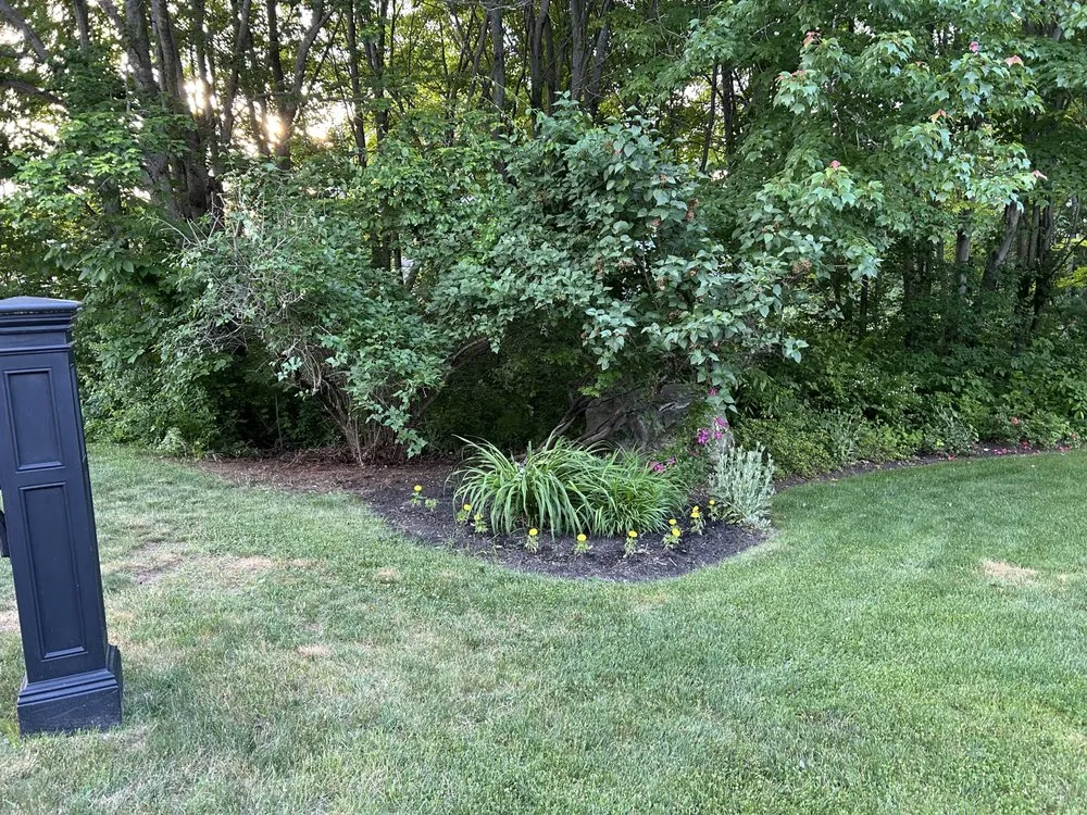 Custom garden landscaping for outdoor upgrades in Auburn, ME by D&H Lawn Services