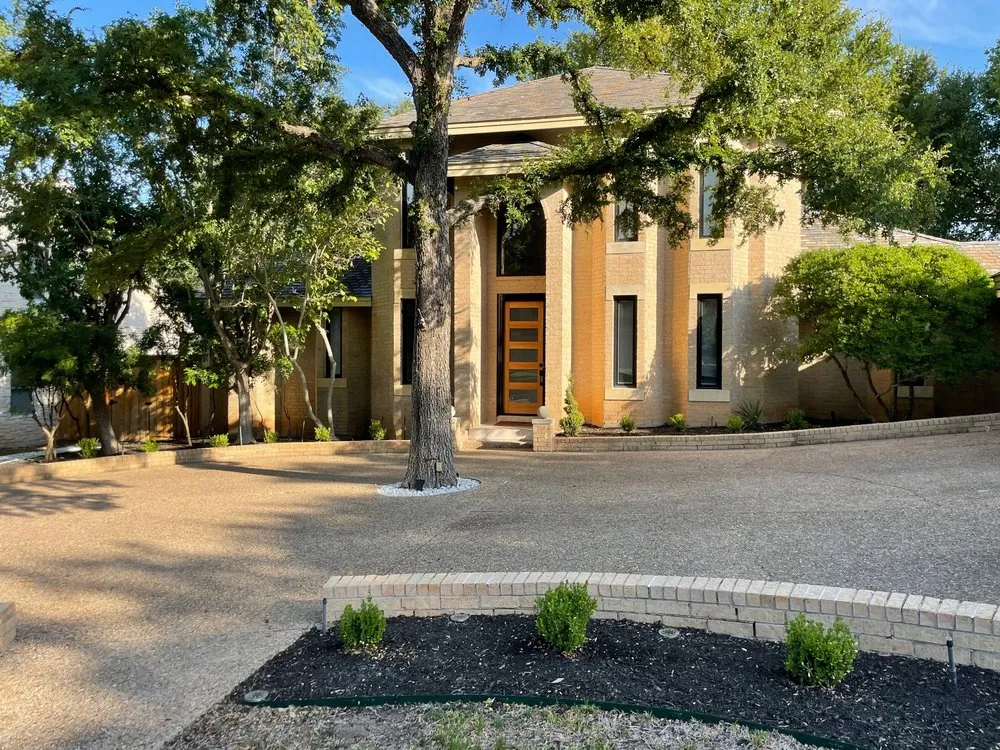 Custom landscape design for year-round maintenance in Austin, TX by Dimas Trees & More