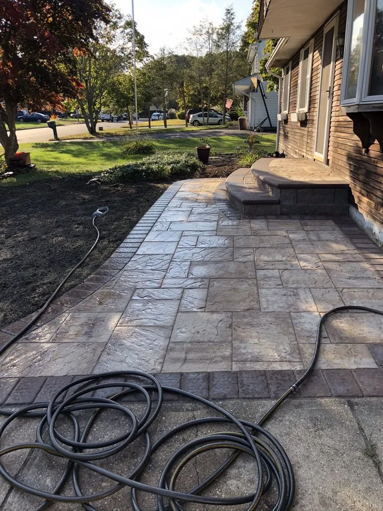 Reliable lawn mowing service for residential properties in Coram, NY by Dimassi and Sons Landscaping