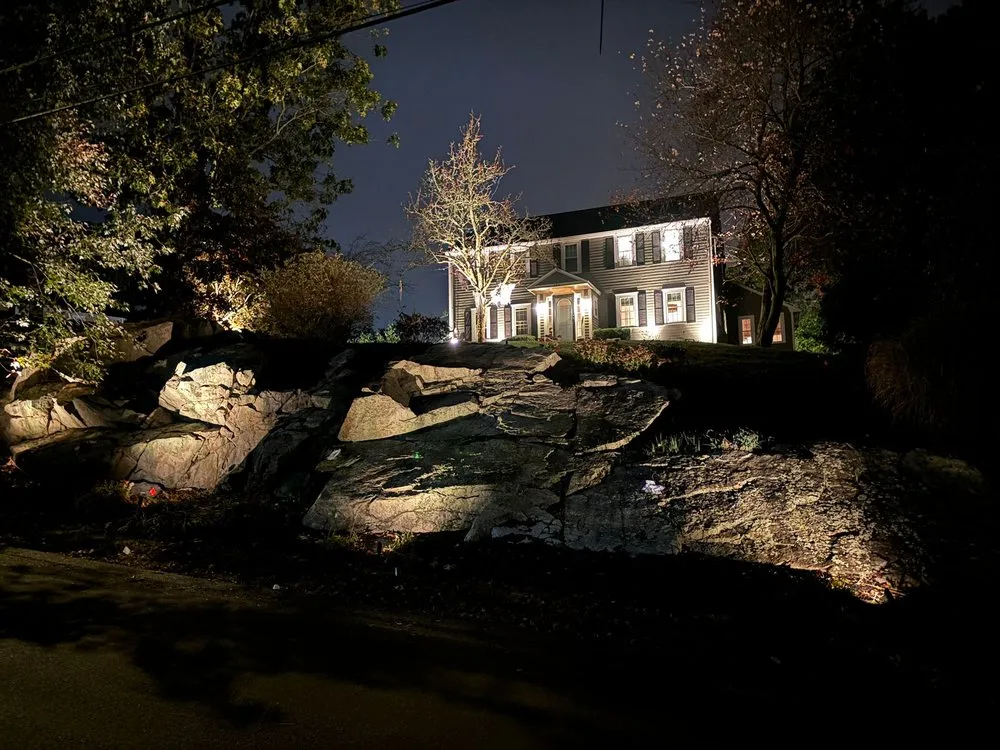 Affordable lawn care service for residential properties in Cohasset, MA by Dino Landscape Construction