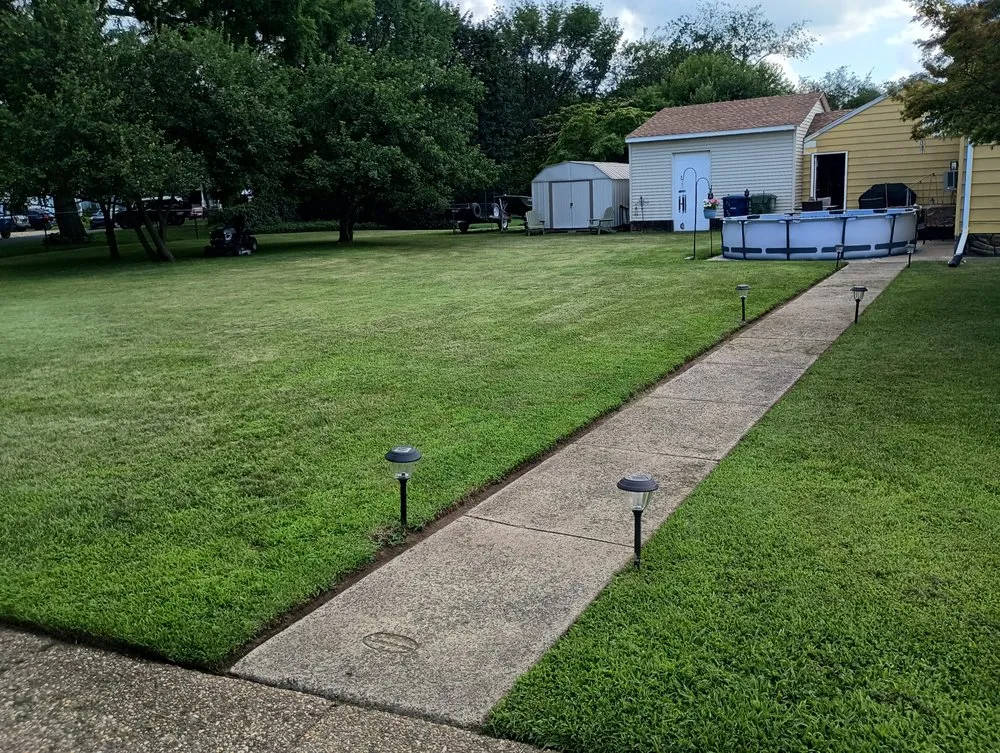 Professional lawn mowing service for outdoor upgrades in Philadelphia, PA by Divine Design Landscapes