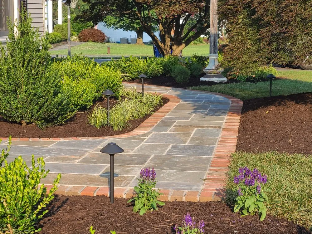 Local yard maintenance for year-round maintenance in Damascus, MD by Divine Landscaping