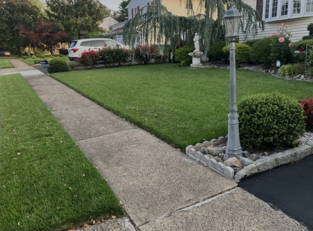 Professional landscape installation in Hasbrouck Heights, NJ by DNA Lawn Care