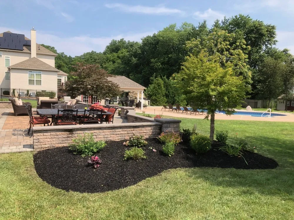 Custom landscape installation with custom design across Glassboro, NJ - Dogwood Designs
