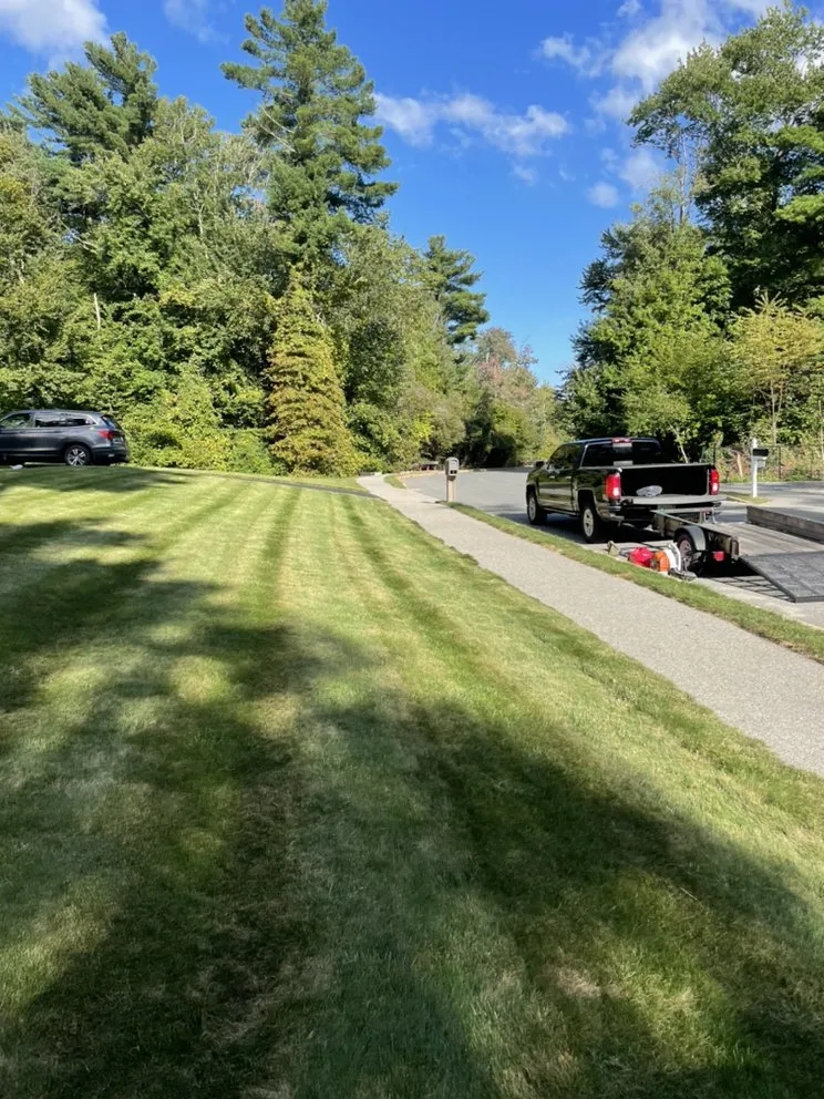 Affordable lawn mowing service for year-round maintenance in Holbrook, MA by Doherty Landscaping
