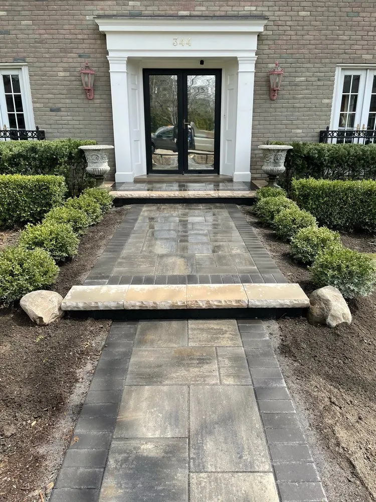 Professional lawn care service for year-round maintenance in Birmingham, MI by Domenico Brick Paving & Landscaping