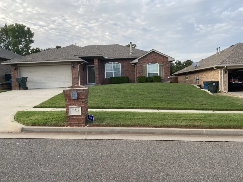 Affordable yard maintenance with custom design in Del City, OK by Dominicks Landscapes