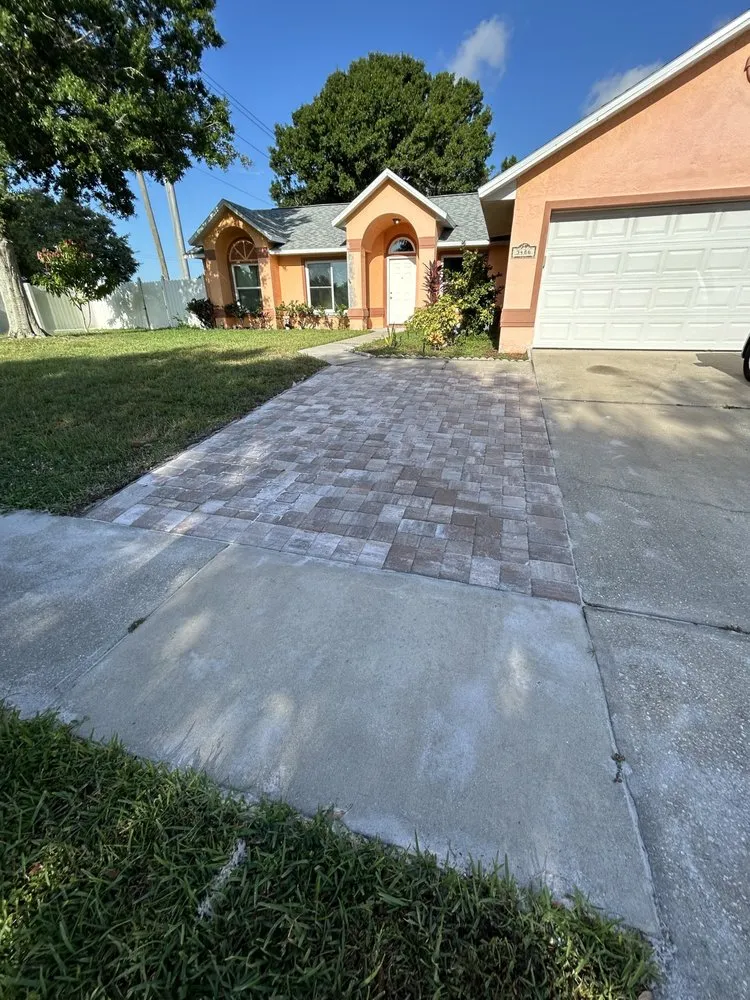 Local lawn mowing service with custom design in Melbourne, FL by Dominion Pavers