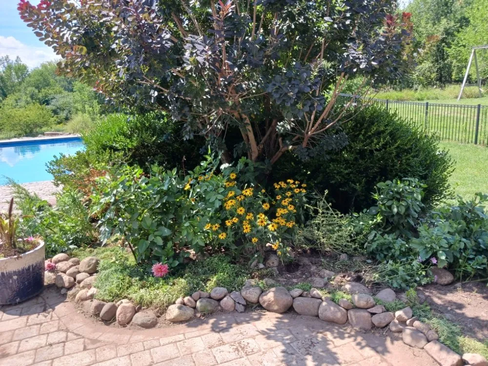 Custom landscape design for year-round maintenance in Battle Creek, MI by Done and Done Lawncare and Home Improvement