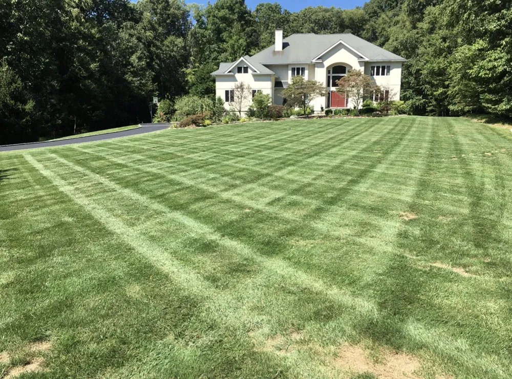 Custom lawn mowing service for homes in Bedford, NY by Donis Landscaping