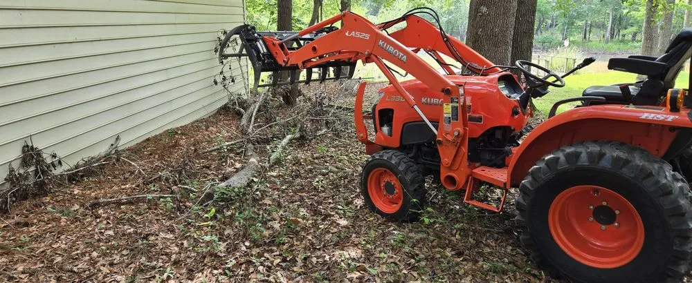 Trusted yard cleanup service in Lugoff, SC by Doug's Lawn Tractor & Hauling Services