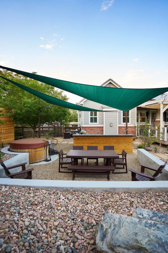 Affordable lawn mowing service for outdoor upgrades in Denver, CO by Down To Earth Landscaping