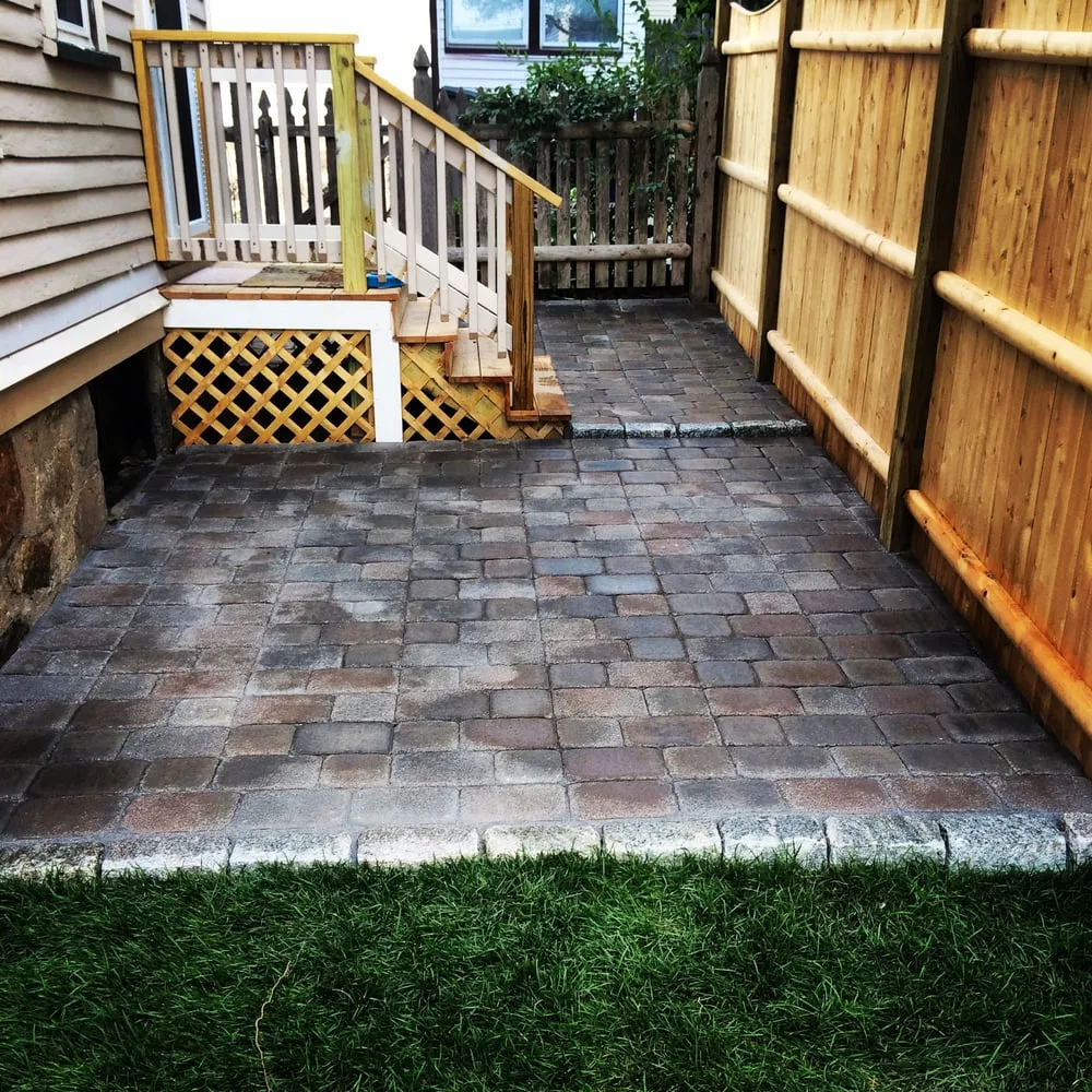 Custom landscape installation for outdoor upgrades in West Roxbury, MA by Dr GreenThumb Landscaping