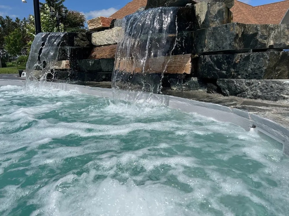 Custom landscape installation in Knapp, WI by Dreamscapes Natural Pools