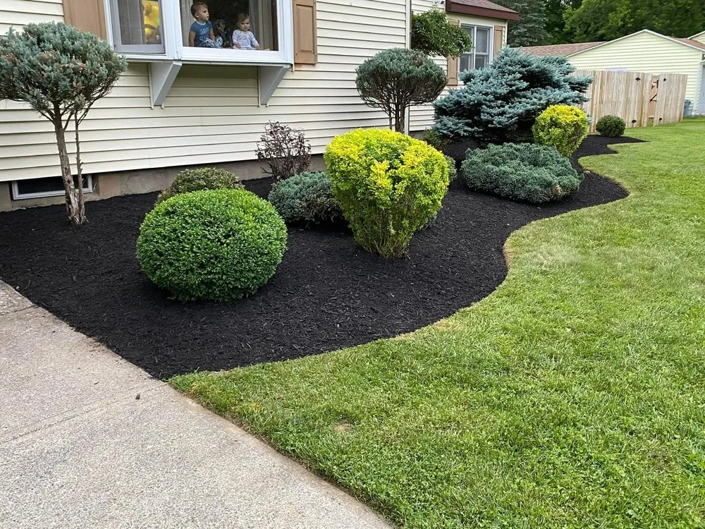 Custom lawn mowing service with custom design across Holland Patent, NY - Dreyer's Landscaping & Snowplowing