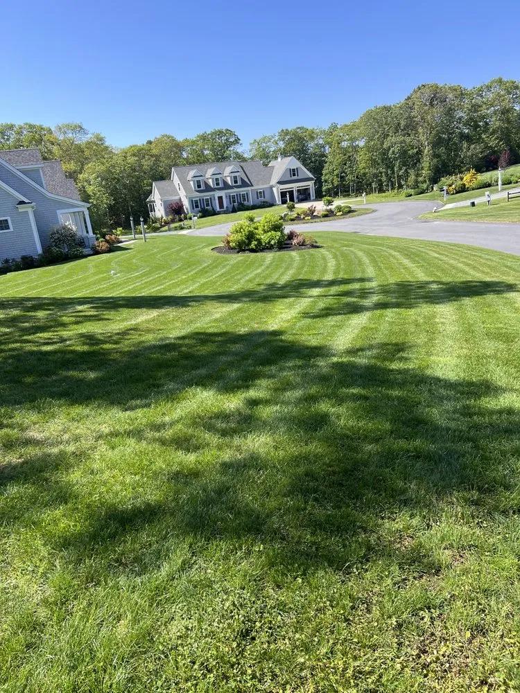 Affordable lawn care service for year-round maintenance in South Yarmouth, MA by Duncan's Landscaping and Masonry