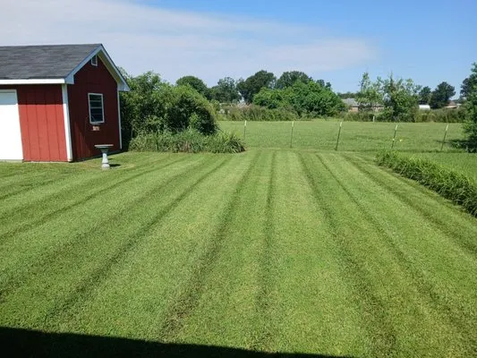 Dupre’ Lawn & Gardening Services Logo