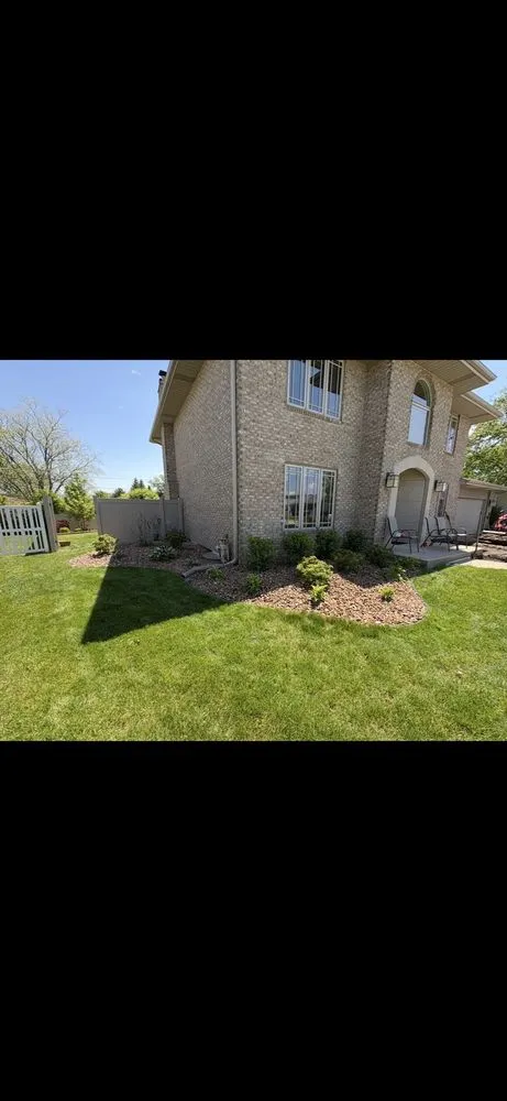 Custom landscape design with custom design in New Lenox, IL by Dutch Barn Landscaping