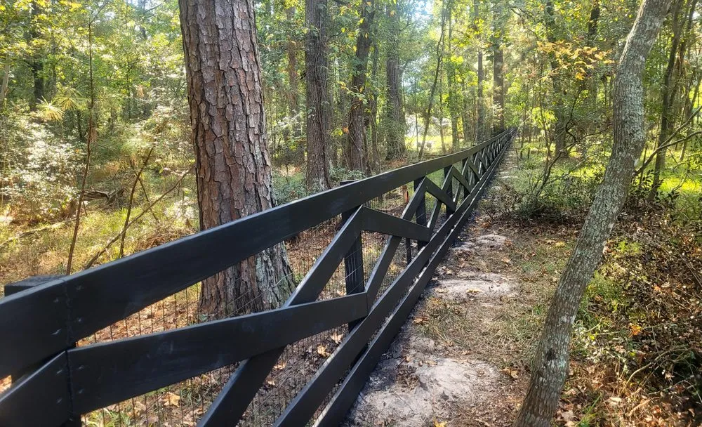 Affordable landscape design for year-round maintenance in Magnolia, TX by DWS Fencing