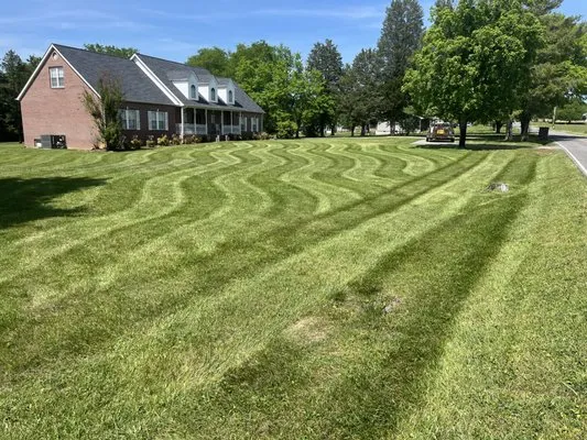 E & W Lawn Care Logo