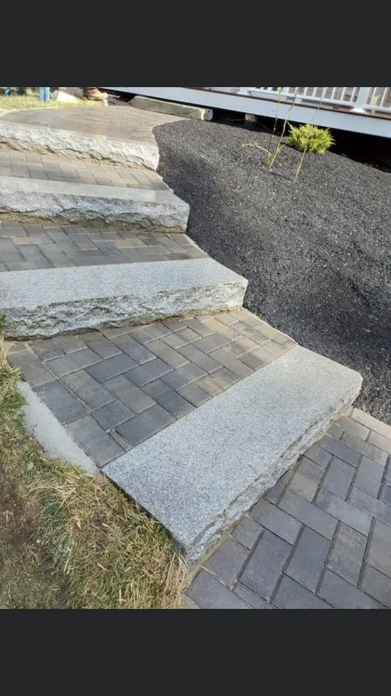 Custom landscape design for year-round maintenance in Methuen, MA by E M Pro Landscaping & Construction