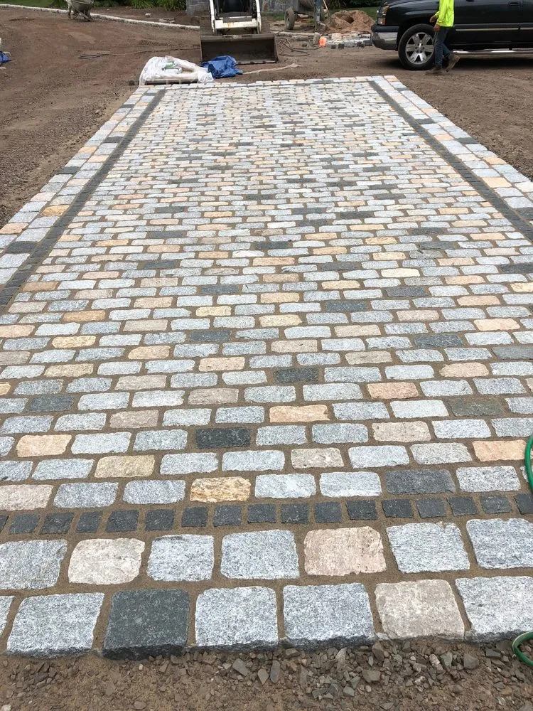 Custom landscape installation for year-round maintenance in Glastonbury, CT by E.A. Quinn Landscape Contracting