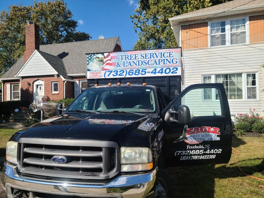 Custom landscape installation for year-round maintenance in Freehold, NJ by Eagle Tree Service