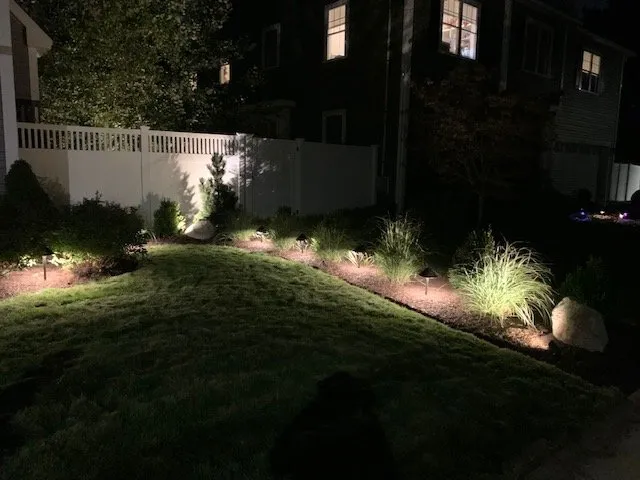 Custom landscape design with custom design in North Reading, MA by Earth Stone and Water