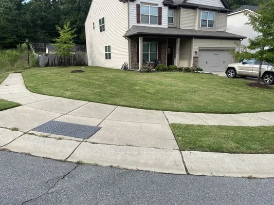 Earth tending lawn care Logo