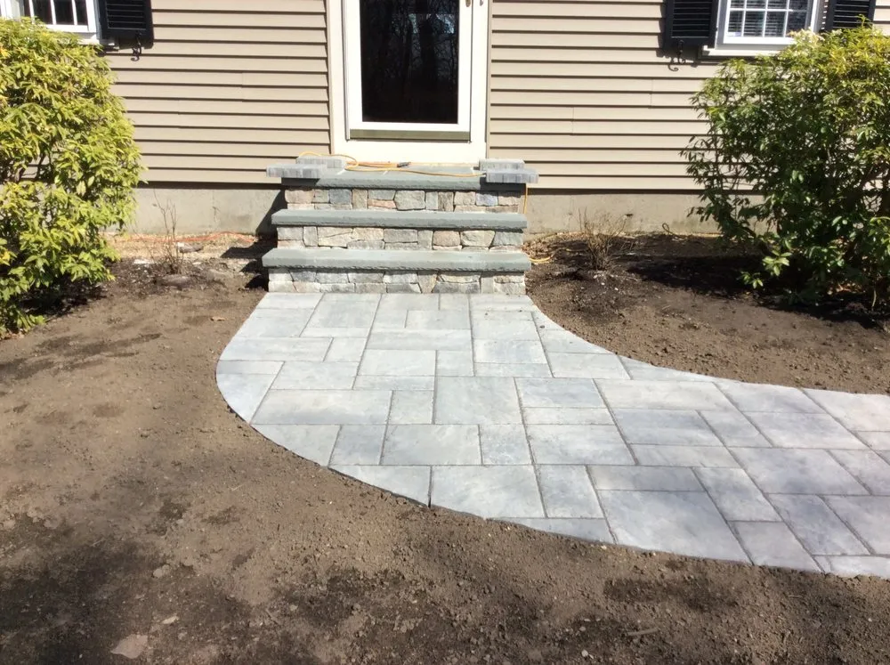 Custom lawn mowing service for homes in Groton, MA by Earthscape