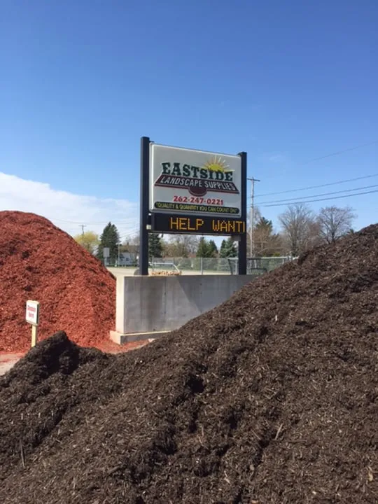 Expert lawn mowing service for outdoor upgrades in West Bend, WI by Eastside Landscape Supplies