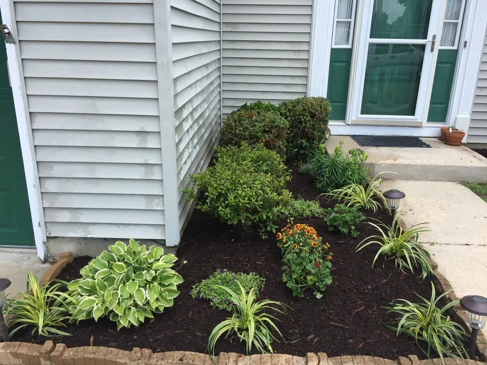 Custom landscape design for residential properties in Newport News, VA by Easy Does It Lawn Care & More