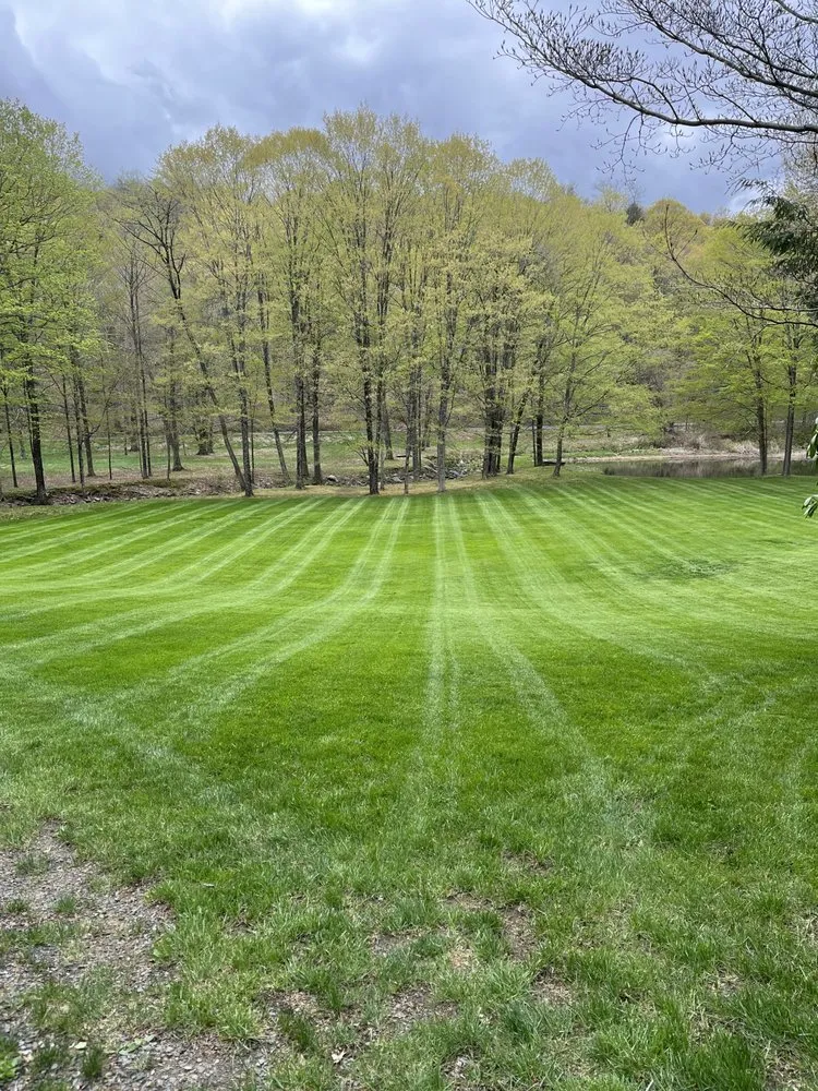 Trusted lawn care service with custom design in New Milford, CT by Eco Earth Landscaping