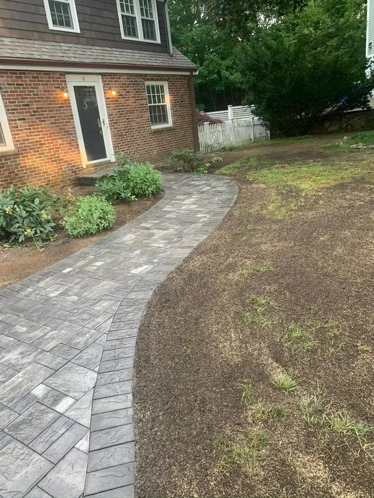 Professional lawn mowing service with custom design across Framingham, MA - Ecoland Landscaping & Masonry