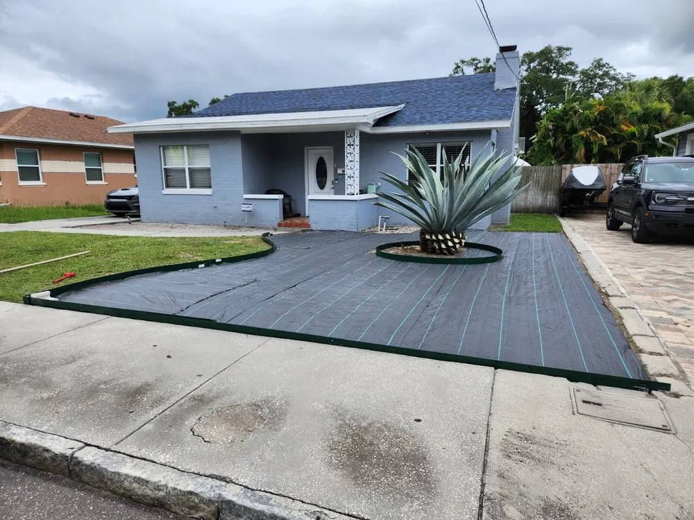 Custom yard cleanup service with custom design in Tampa, FL by Economy Landscaping